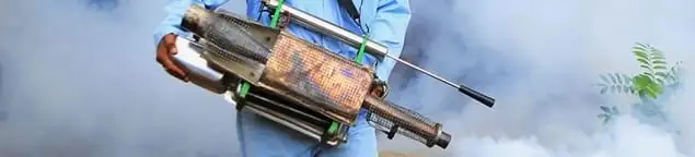 Fumigation technician using a fogger for deep pest treatment in Indianapolis, IN